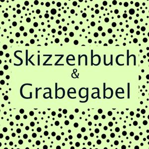 Skizzenbuch und Grabegabel